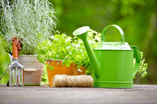Harrow garden design featuring trees, shrubs, and decorative hard landscaping